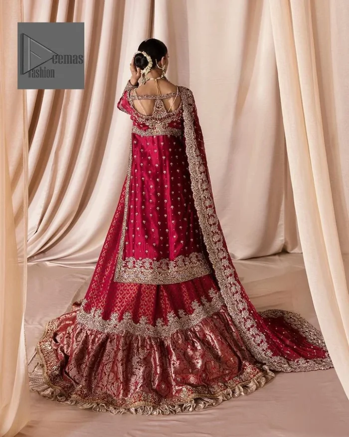 The maroon color is the perfect feminine and delicate shade with its meticulously crafted untruth The gorgeous shirt is embellished with tilla, dabka, kora, Kundan, and Zardozi. The colour of the embroidery is gold. Everyone is captivated by the shirt’s boat shape neckline. Moreover, the shirt’s three quarter sleeves are embellished with floral designs. It is coordinated with scalloped lehenga having beautiful border embellished. Complete this outfit with dupatta framed with a four sided embellished scalloped borders