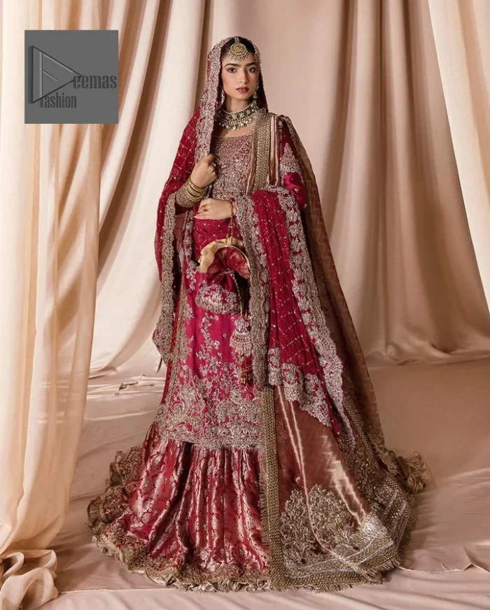 The maroon color is the perfect feminine and delicate shade with its meticulously crafted untruth The gorgeous shirt is embellished with tilla, dabka, kora, Kundan, and Zardozi. The colour of the embroidery is gold. Everyone is captivated by the shirt’s boat shape neckline. Moreover, the shirt’s three quarter sleeves are embellished with floral designs. It is coordinated with scalloped lehenga having beautiful border embellished. Complete this outfit with dupatta framed with a four sided embellished scalloped borders
