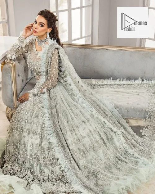 This attire is a testament to grace and sophistication, with its intricate multiple-colour detailing of tilla, dabka, kora, Kundan, Zardozi