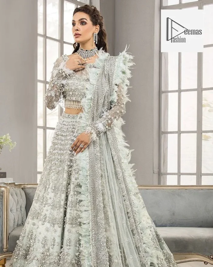 Complete this article with a dupatta framed with four-sided embellished borders and floral motifs all over.