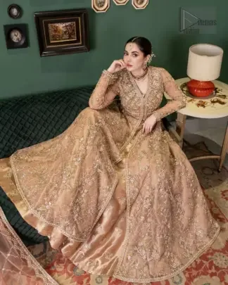 This dark salmon pink dress is a perfect blend of tradition and modernity, designed to make you stand out on your special day. Crafted with dull golden and antique shades of embroidery which involves tilla, dabka, kora , Kundan and the real magic of Zardozi