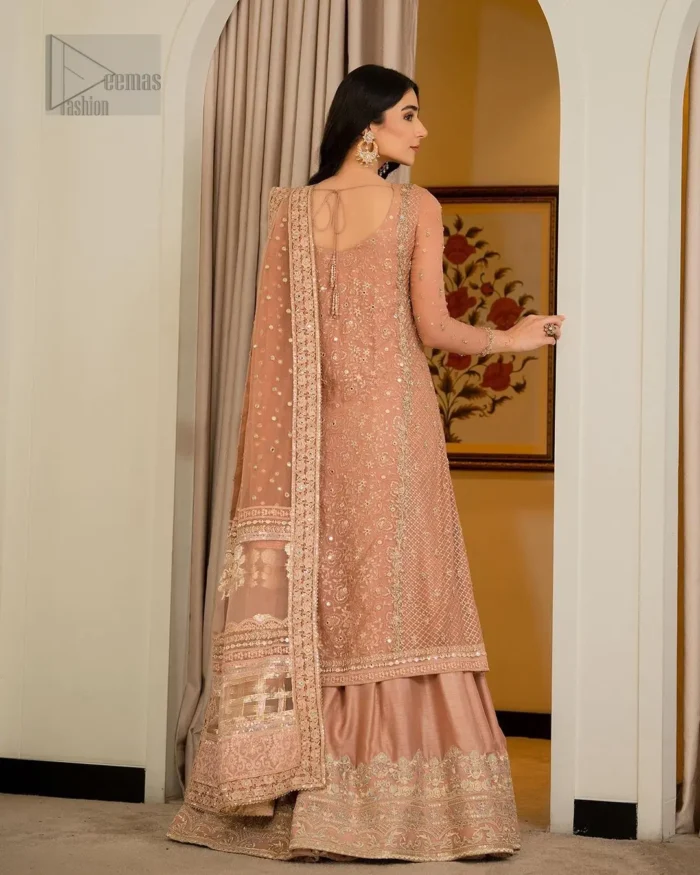 With its bordered embellished sharara made from premium materials, this Nikah dress ensures both comfort and style, allowing you to gracefully step into your new chapter. It is paired up with a dupatta having four sides embellished border.