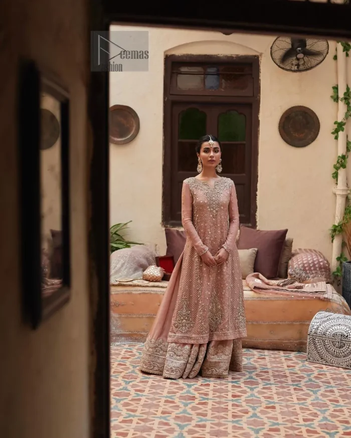 Introducing our exquisite Salmon Pink Nikah dress, a masterpiece designed to make your special day truly memorable. Crafted with utmost precision, this Nikah dress is a blend of tradition and elegance, perfect for your sacred union.