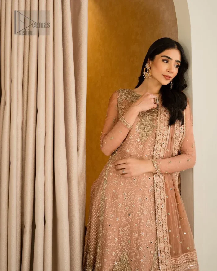 Crafted with utmost precision, this Nikah dress is a blend of tradition and elegance, perfect for your sacred union. Its intricate detailing and delicate embroidery which involves tilla, dabka, kora and Kundan showcase the essence of timeless beauty, enhancing the radiance of the bride.