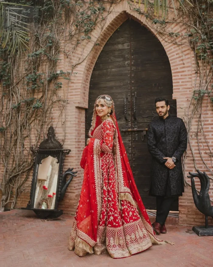 the beautiful floral jaal lehenga offers a truly distinctive look, making you the center of attention. Elevate your wedding day with a touch of elegance and charm, as you shine in this extraordinary reception outfit.