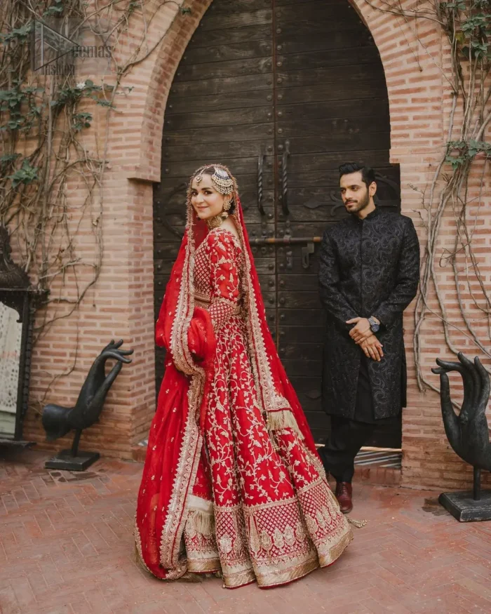 This unique dress is a masterpiece of design that involves light golden and bosky shades of embroidery having tilla, dabka, kora, Kundan, and Zardozi