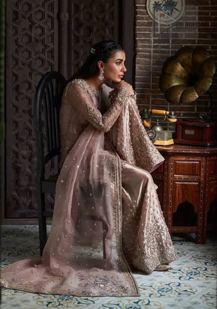 The classic dupatta in the same color symbolizes the essence of the Nikah, while delicate embellishments add a touch of sophistication.