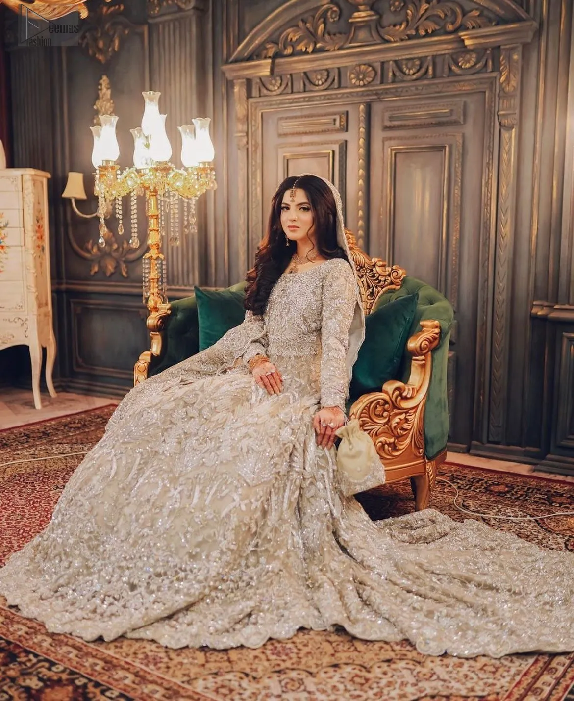 Adorned with delicate silver embroidery, the entire design glimmers with understated beauty. Crafted from organza and raw silk, this masterpiece offers a blend of luxury and tradition.