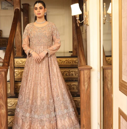 The voluminous Can-Can layers of the lehenga sway with every step, creating a dreamy, flowing effect.