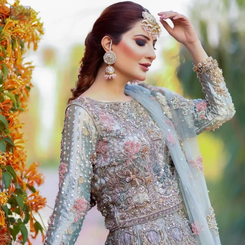 Redefine elegance with the Mint Green Lehenga Blouse Dupatta, a perfect dress for your Walima. Mint Green Lehenga Blouse Dupatta