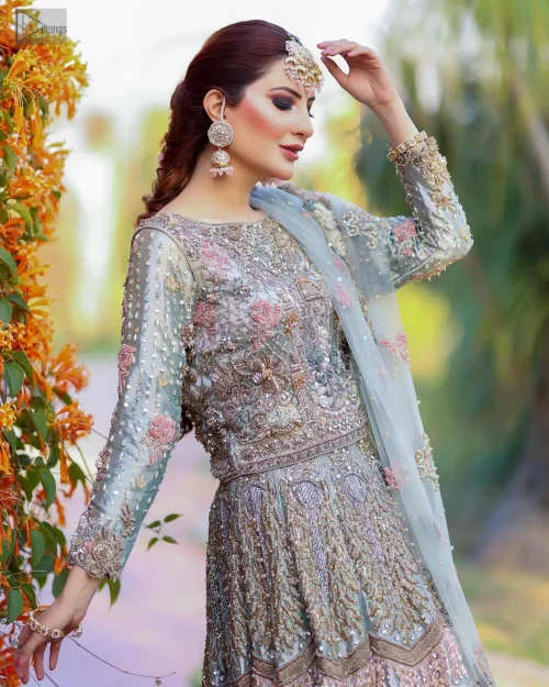 Step into the spotlight with this ethereal creation that charismatically blends tradition and modern elegance.