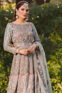 Redefine elegance with the Mint Green Lehenga Blouse Dupatta, a perfect dress for your Walima.