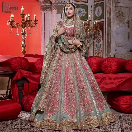 The flowing pistachio green lehenga, adorned with gotta work and applique, sways with every step, while the net dupatta adorned