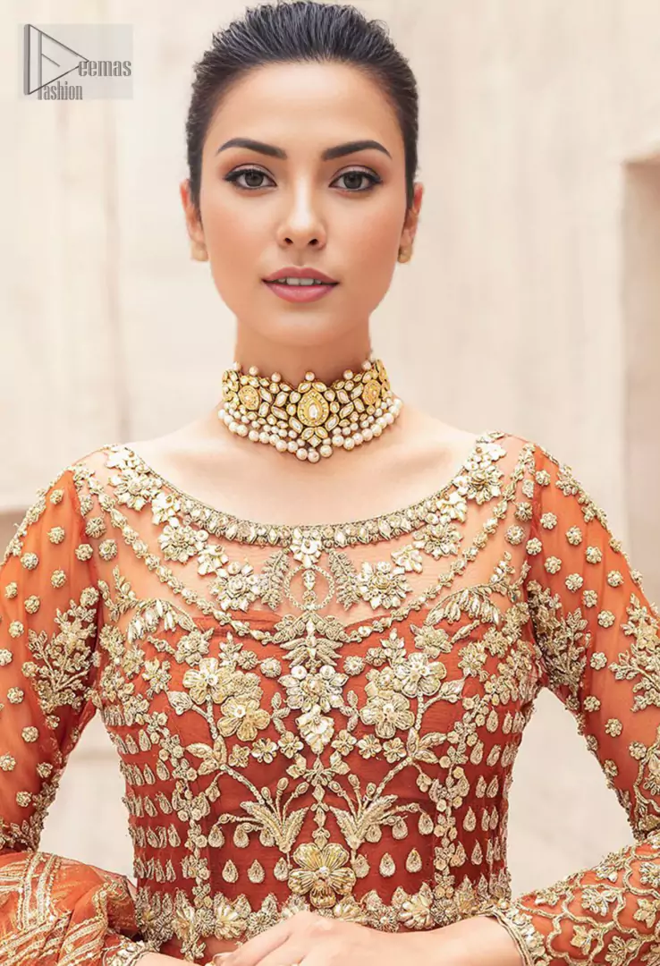 Full sleeves and a sweeping long-length lehenga crafted from luxurious organza complete this masterpiece, making you feel like a queen on your special day.