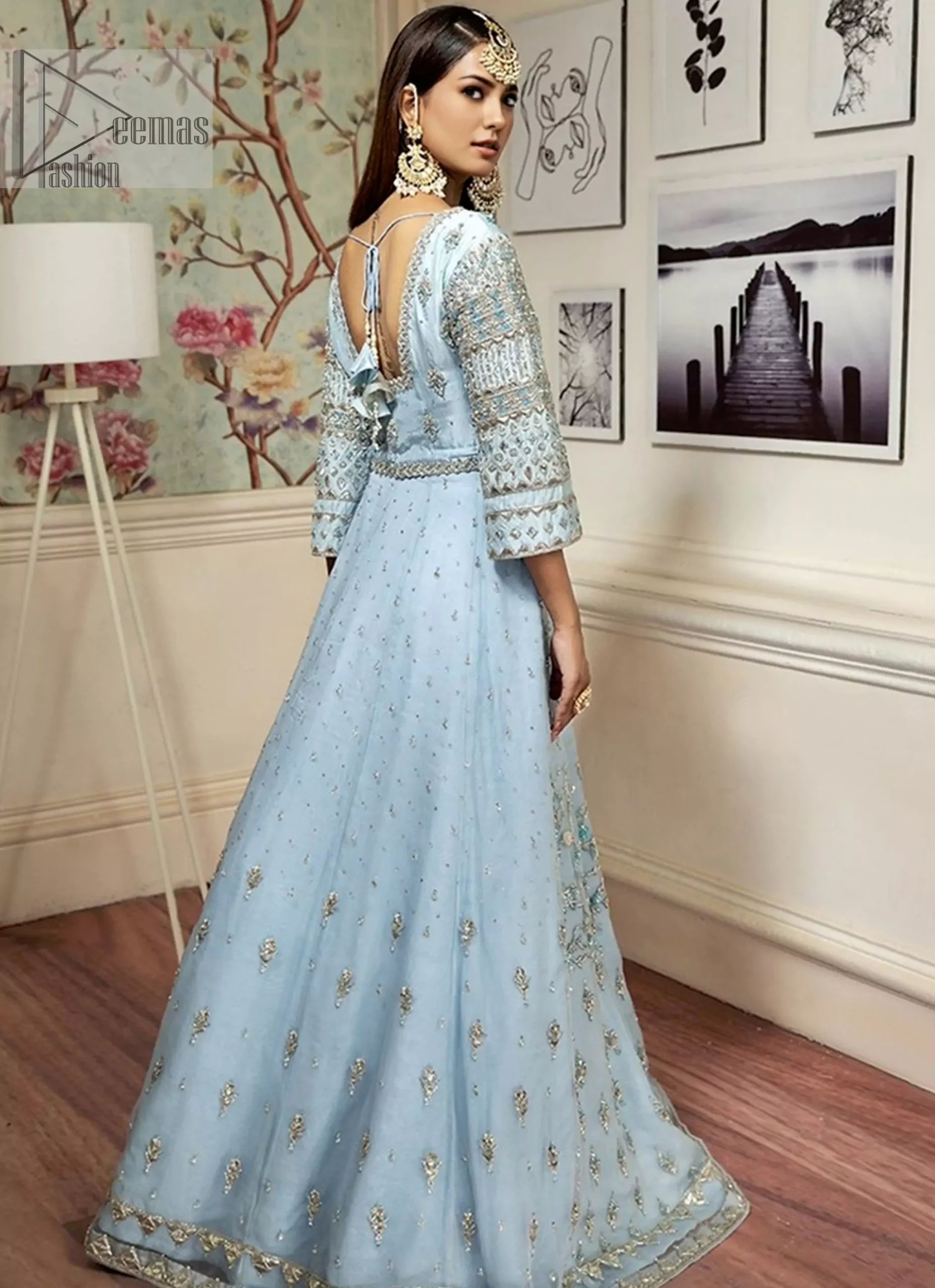 It’s your day to shine, and what’s better than bridal wear that intensifies your divine persona? This stunning attire is designed for the Nikah bride who seeks charisma and grace. The lehenga and blouse are crafted from the finest pure tissue silk and feature the most mesmerising silver & dull golden embroidery that beautifully aligns with the soft sky-blue hue.