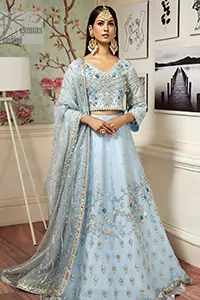 The lehenga and blouse are crafted from the finest pure tissue silk and feature the most mesmerising silver & dull golden embroidery that beautifully aligns with the soft sky-blue hue.