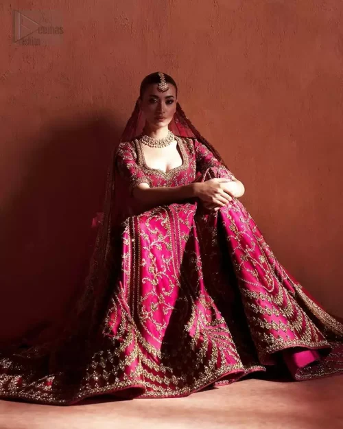 Floral & Geometric Blend: A focus on the harmony between the sharp geometric lehenga patterns and the soft floral motifs