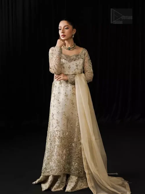 Step into the spotlight at any formal gathering with this ivory sharara set, where timeless tradition meets contemporary elegance.