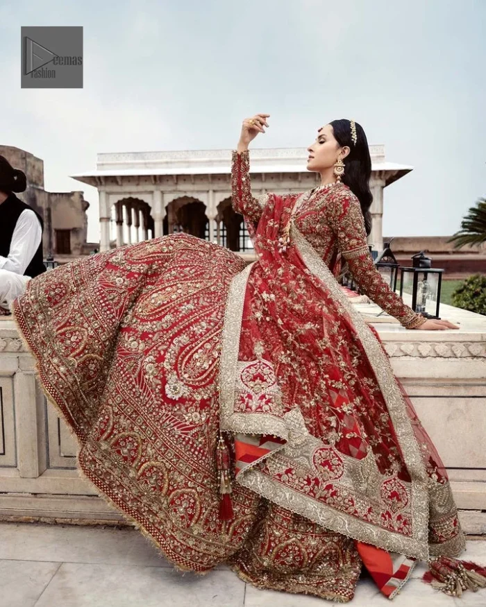 Make your day bright and bold! Deemas Fashion presents a beautiful red outfit which involves silver embroidery and is covered with tilla, dabka, kora, Kundan and the beautiful details of Zardozi. The full sleeves are covered with attractive floral patterns. Further, the jewel neckline gives a romantic touch to this beautiful outfit. The?Bridal Lehenga?has a massive flare and it gives the gorgeous bride a breathtaking look on the big day.?The Lehenga is gracefully emblazoned with?sequins, crystals, and Resham. Intricate details of zardozi and gota make this Lehenga Dress an epitome of grace. A beautiful dupatta with floral patterns & beautiful embellished border completes the look. Top: Blouse Colour: Red Fabric: Organza Fully Embellished Jewel Neckline Silver Embroidery Full-Length Sleeves Floral Patterns Concealed With Side Zip Finished Edges Bottom: Lehenga Colour: Red Fabric: Organza Fully Embellished Flared Finished Edges Fixed Waist Belt With Side Zip Closure Dupatta: Colour: Red Fabric: Net Floral Patterns Dupatta Having Four Sides Embellished Border Finished Edges Embellishment : Work includes kora, dabka, stones, sequins, beads, silk threads and Swarovski crystals. 100% pure highest quality imported fabric.