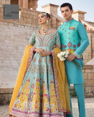Effortlessly achieve the perfect bride look with this mehndi wear! Turquoise Frock is adorned with gorgeous motifs in multiple colors. It is further encrusted with the magic of gota, pitta, naqshi, Zardozi, tilla, and dabka along with sequins and pearls. The round neckline gives a traditional look to the outfit. Further, the tiny floral motifs also intensify the beauty of the masterpiece. This piece is paired up with an orange lehenga to make the contrast balance. Complete this outfit with a dupatta framed with four-sided borders to make your day versatile and charming.