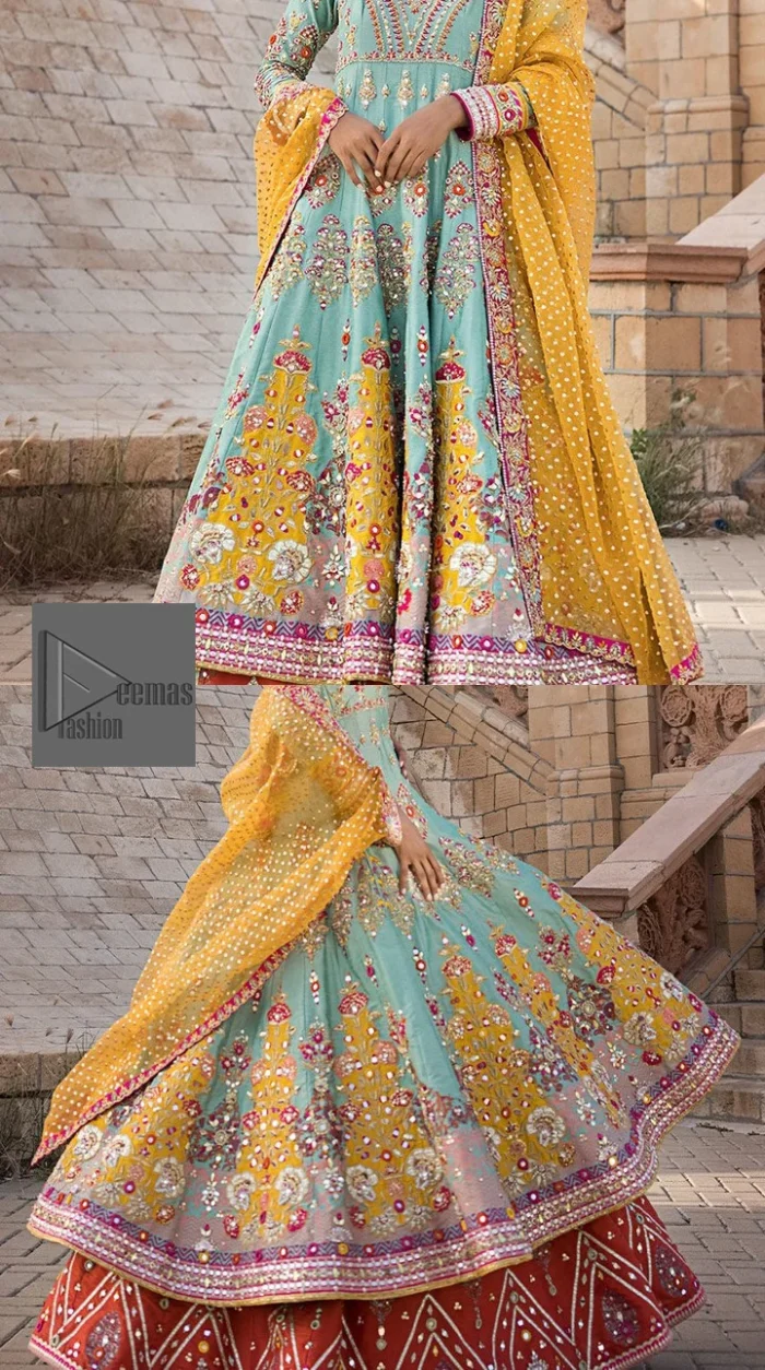 Effortlessly achieve the perfect bride look with this mehndi wear! Turquoise Frock is adorned with gorgeous motifs in multiple colors. It is further encrusted with the magic of gota, pitta, naqshi, Zardozi, tilla, and dabka along with sequins and pearls. The round neckline gives a traditional look to the outfit. Further, the tiny floral motifs also intensify the beauty of the masterpiece. This piece is paired up with an orange lehenga to make the contrast balance. Complete this outfit with a dupatta framed with four-sided borders to make your day versatile and charming.