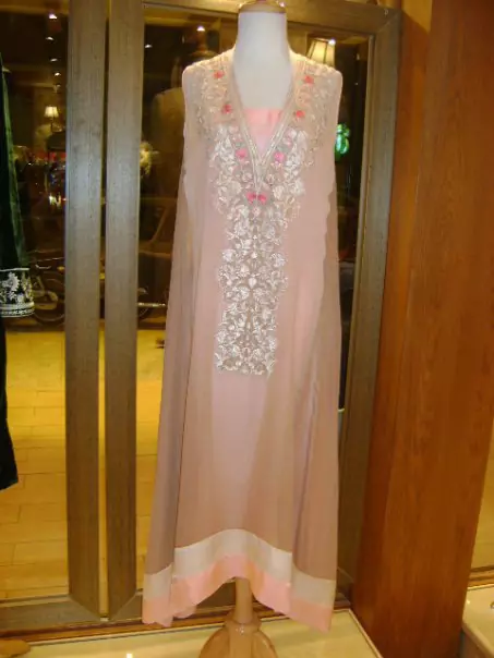 This shirt is perfect for a day to evening wear. Gussy up in this luxuriously designed shirt emboldened with thread embroidery along with beautiful rich patterns and delicate details on neckline. Embroidery is in two colors. It is coordinated with churidar pajama. This outfit is paired up with matching chiffon dupatta.